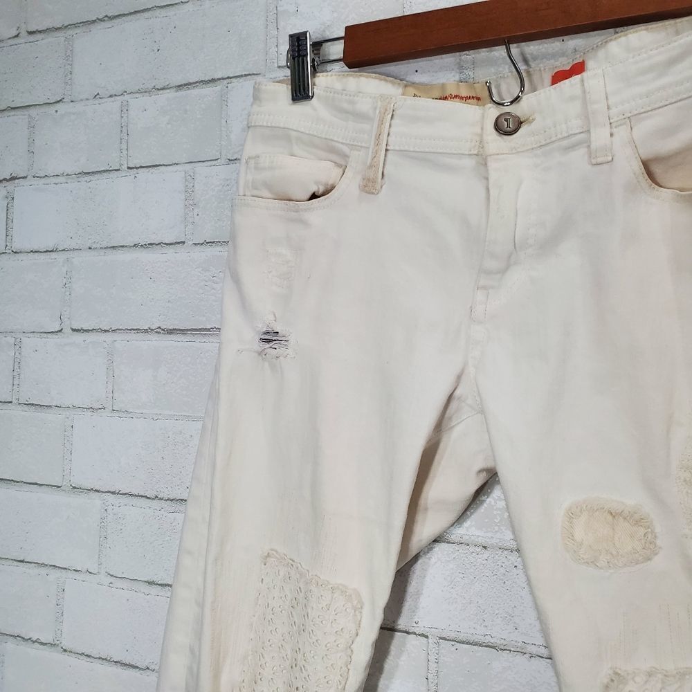 Women's Distressed White Patch Jeans - Picture 8 of 16